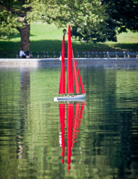 A toy yacht on a pond in Central Park in New York City