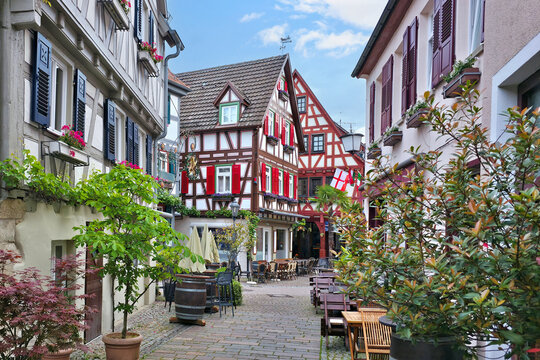 Cobblestone street with historic half timbered architecture in the beautiful village of Besigheim, Germany.