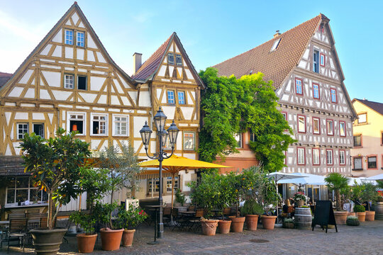 Cobblestone square with historic half timbered architecture in the idyllic village of Besigheim, Germany.