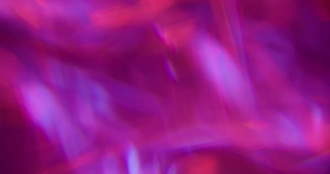 Defocused glow light. Art flare. Pink blue purple colorful lens glisten rainbow radiant kaleidoscope on abstract neon bokeh background.