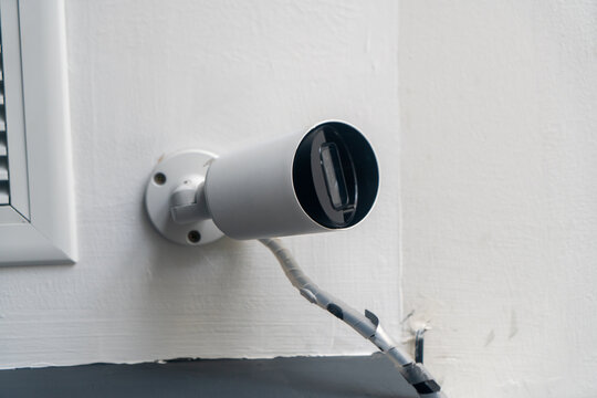 Modern Compact Camera Lens on White Wall