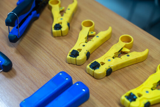 Electrical Testing Tools and Safety Equipment on Workbench