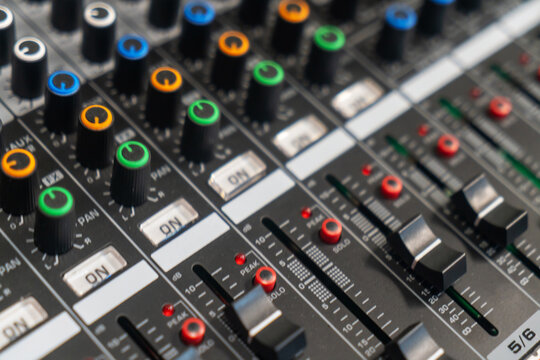 Professional Audio Mixing Console with Knobs and Faders