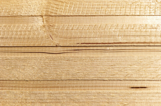 Light brown wooden plank, grain texture in beige tones, suitable as a background