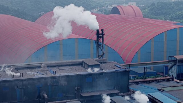 Static view of heavy smoke emitting from an industrial chimney. Perfect for concepts of manufacturing, energy, carbon emissions, and environmental pollution.