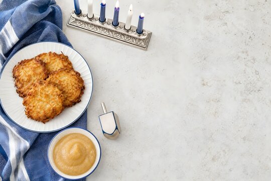 Hanukkah Celebration Still Life with Latkes Applesauce and Menorah