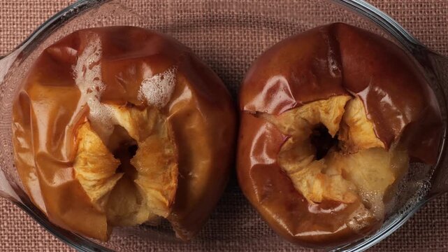 Delicious baked apples in glass dish dolly shot