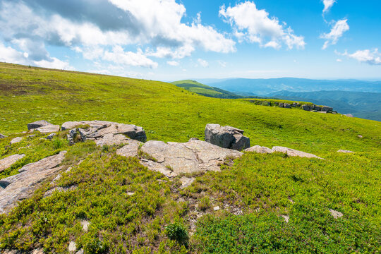 carpathian mountain landscape in summer. amazing background for outdoor adventure. transcarpathia green hill with rocks. sunny day with blue sky