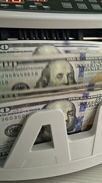 Money counting machine in action at a financial office