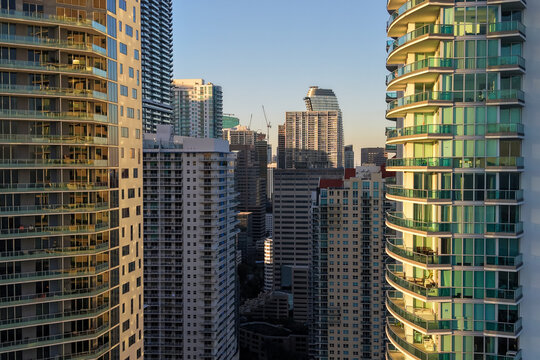 Skyscrapers and apartment towers filling the urban skyline at sunset