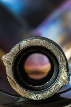 Cross Section of a Steel Coupling with Industrial Metal Background Structure and Dramatic Lighting