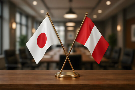 Small desk flags of japan and peru crossed on a wooden table in a blurred office boardroom with dark chairs and soft overhead lighting