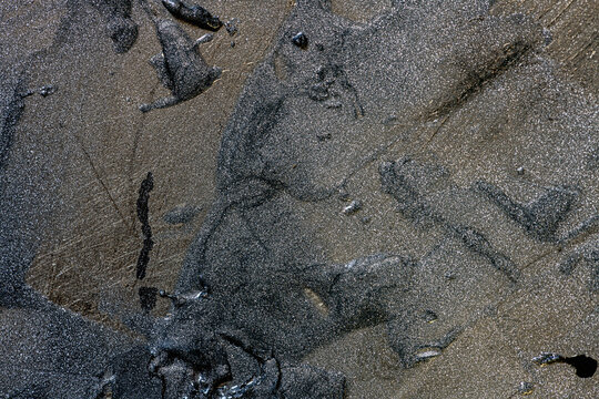 Dried Epoxy Adhesive Layer on a Metal Surface Forming an Abstract Industrial Texture