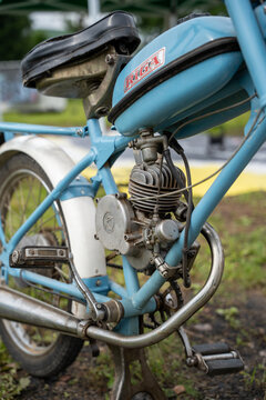 Zaube, Latvia &ndash; August 2, 2026: Vintage Riga motorized bicycle with exposed engine displayed at an outdoor vehicle event.