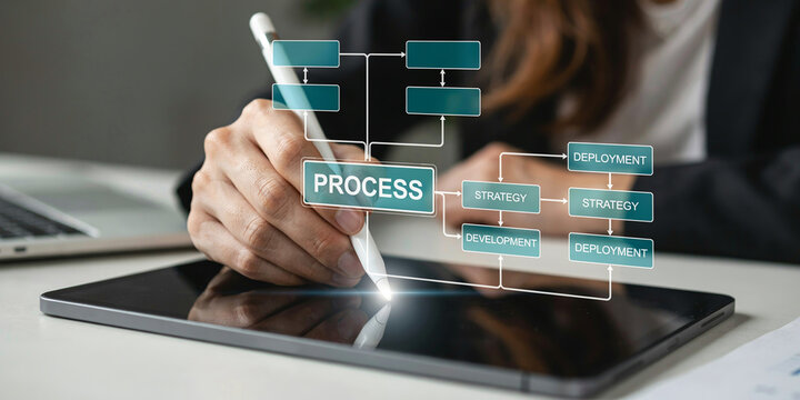 Business analyst using digital stylus to plan professional development workflow.