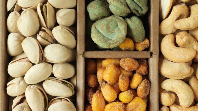 Assortment of nuts and snacks slowly moving