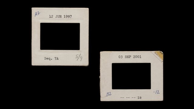 Two blank vintage slide mounts isolated on black background