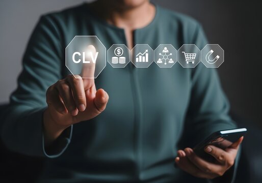 Businesswoman touching digital screen with clv customer lifetime value icons for marketing