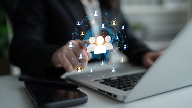 Business Professional Using Laptop with Digital Network Connections for Team Collaboration and Communication in Modern Workspace Environment. Entropy.