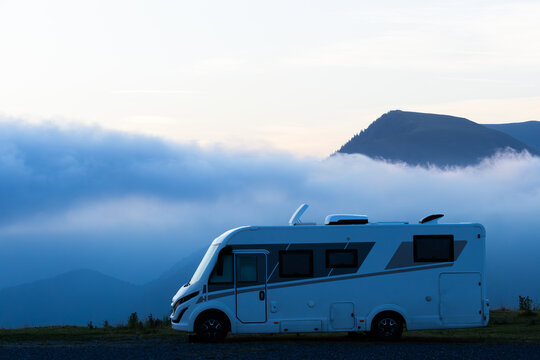 Motorhome parked in Superbagneres mountains during sunrise