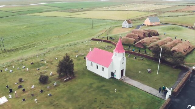 Drone view of Glaumbaer Village with iconic red church and
