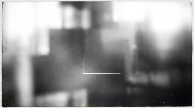 Abstract black and white blurred background with light leak