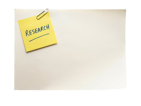 Yellow sticky note with the word Research written in blue ink and a paper clip isolated on transparent background