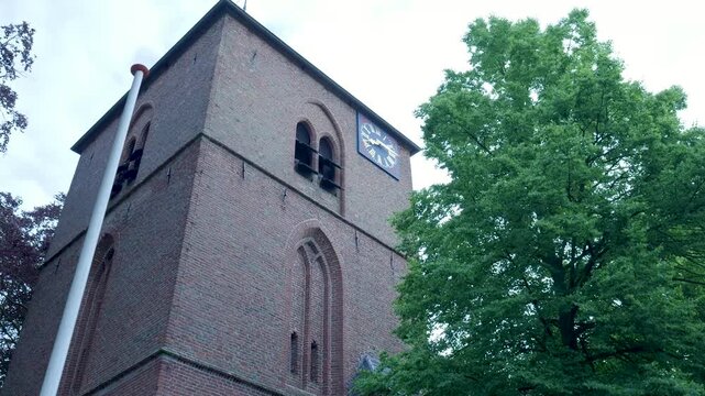 Low angle view of an old church clock tower