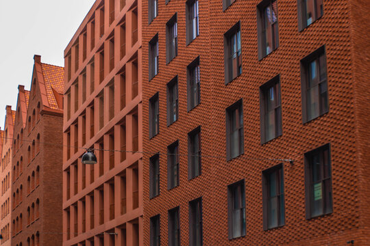 Close up of a brick modern facade with windows, Gdansk, Poland