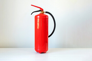 Obraz premium Fire extinguisher, isolated on a white background. Fire safety, emergency preparedness, fire prevention, occupational health and safety