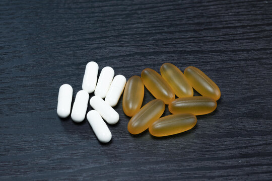 Close-up of yellow omega-3 fish oil softgel capsules