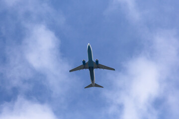 Fototapeta premium An airplane against a sky with clouds