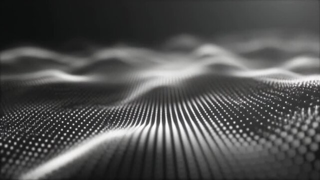 Wavy digital surface with grid pattern moving gracefully in dark ambient lighting