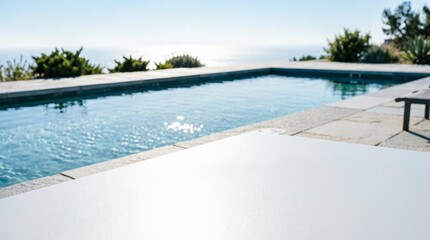 Fototapeta premium Swimming Pool with Ocean View and Stone Deck for Luxury Lifestyle