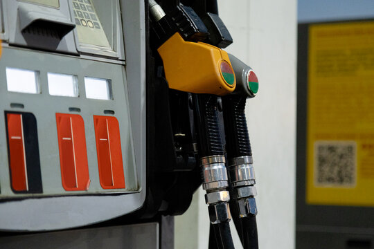Fuel pump nozzles at self-service gas station