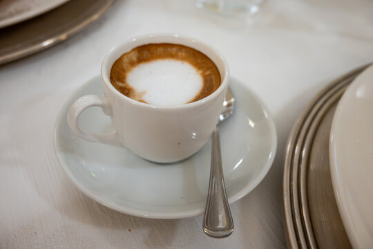 Barista made coffee cappuccino with foam heart with soy milk vegan drink