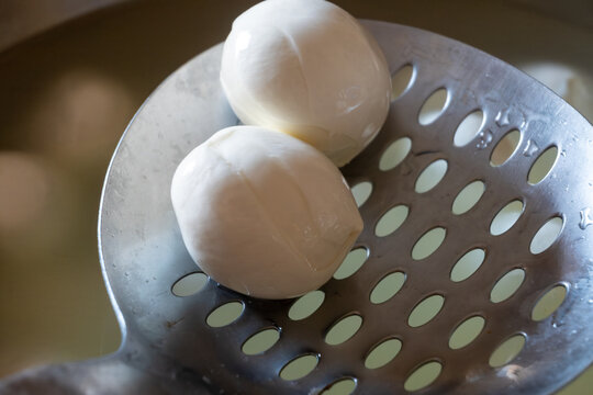 Fresh buffalo mozzarella or mozzarella di bufala white soft cheese in balls