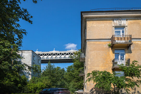 Western High-speed Diameter (ZSD) between residential buildings, close-up. Kanonerskiy Island, Saint Petersburg
