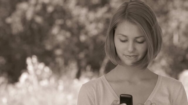 smiling beautiful young woman with phone
