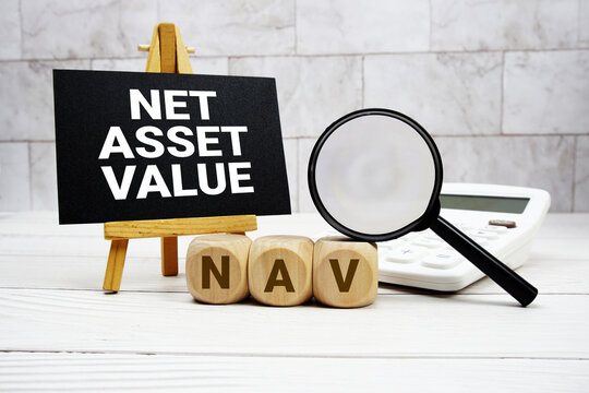 NAV  Net Asset Value text with calculator magnifying glass and on wooden background