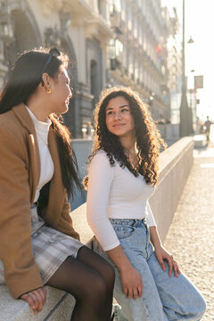 Friends enjoy sunny urban moment together in Madrid