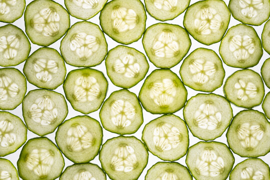 Fresh cucumber slices arranged in an overhead food pattern