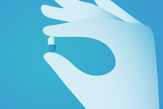 Female Hand Holding Medicine Capsule for Healthcare Concept.