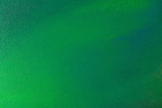 Green abstract textured background with bright gradient design