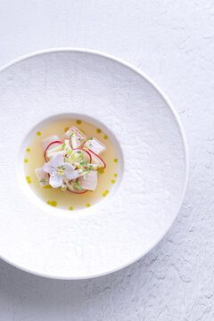 Peruvian ceviche with fish and fresh vegetable garnish