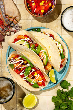Traditional Mexican shrimp tacos with avocado and cilantro