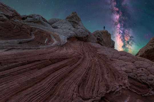 Milky Way rising over desert sandstone under dark sky