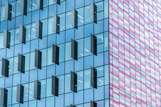 Modern glass facade detail with angled window panels