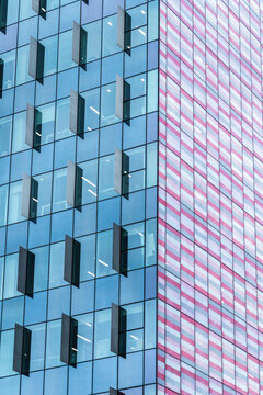 Modern glass facade detail with geometric window pattern