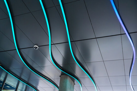 Contemporary ceiling with wavy LED light strip design